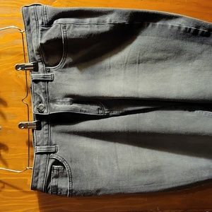 Faded denim jeans with distressed hem